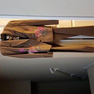 2 piece brown suit with flower embroidery detail and lined jacket. Size 44/14